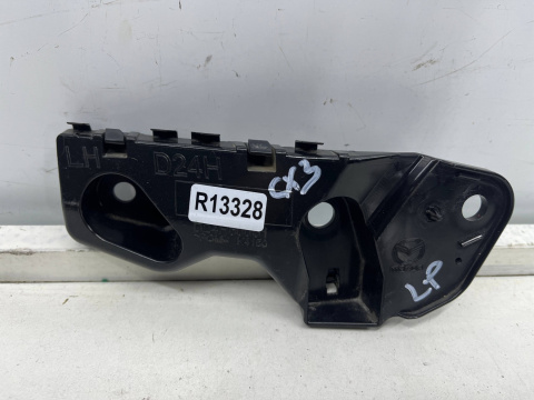 Ślizg Mazda CX-3 14-21r. lewe przednie mocowanie błotnika zderzaka wspornik d24h500u1 d10j500u1 Ślizg Mazda CX-3 14-21r. lewe przednie mocowanie błotnika zderzaka wspornik d24h500u1 d10j500u1