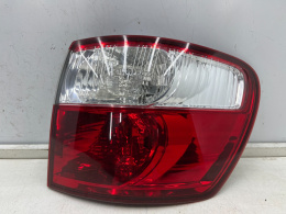 Lampa Toyota Avensis Verso Ipsum LIFT 03-09r. prawa tylna w błotnik oryginalna prawy tył Koito 44-57