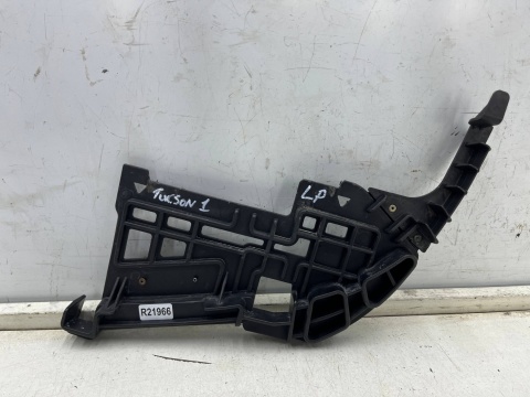 Ślizg Hyundai Tucson I 05-10r. lewe przednie mocowanie reflektora zderzaka wspornik lewy przód 86595-2e000 Ślizg Hyundai Tucson I 05-10r. lewe przednie mocowanie reflektora zderzaka wspornik lewy przód 86595-2e000