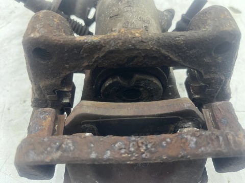 Zacisk hamulcowy Opel Zafira B 05-14r. lewy tył