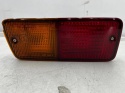 Lampa Nissan Patrol 5 V Y61 91-13r. LEWA tylna przeciwmgielna kierunkowskaz w zderzak halogen oryginalna LEWY tył 26555-vb11b