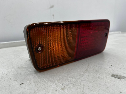 Lampa Nissan Patrol 5 V Y61 91-13r. LEWA tylna przeciwmgielna kierunkowskaz w zderzak halogen oryginalna LEWY tył 26555-vb11b