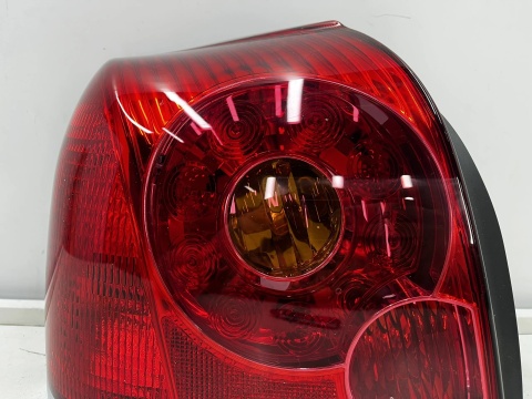 Lampa Toyota Avensis 2 II T25 LIFT 06-09r. HB sedan NOWA lewa tylna EU Oryginalna w błotnik lewy tył 81561-05130