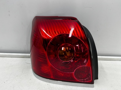 Lampa Toyota Avensis 2 II T25 LIFT 06-09r. HB sedan NOWA lewa tylna EU Oryginalna w błotnik lewy tył 81561-05130