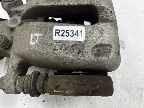 Zacisk hamulcowy Opel Insignia A 08-17r. LEWY tylni jarzmo lewy tył