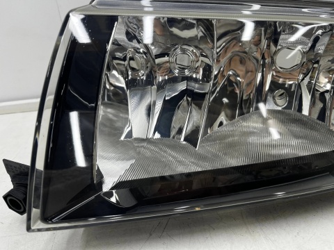 Lampa reflektor Skoda Fabia I 6y 99-08r. LEWA przednia oryginalna EUROPA czarna ramka 6y1941015n